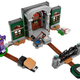 A Lego set featuring a creepy door a goopy, purple ghost.